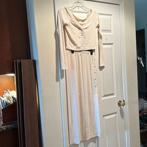 Two cream long sleeve and skirt with slit.